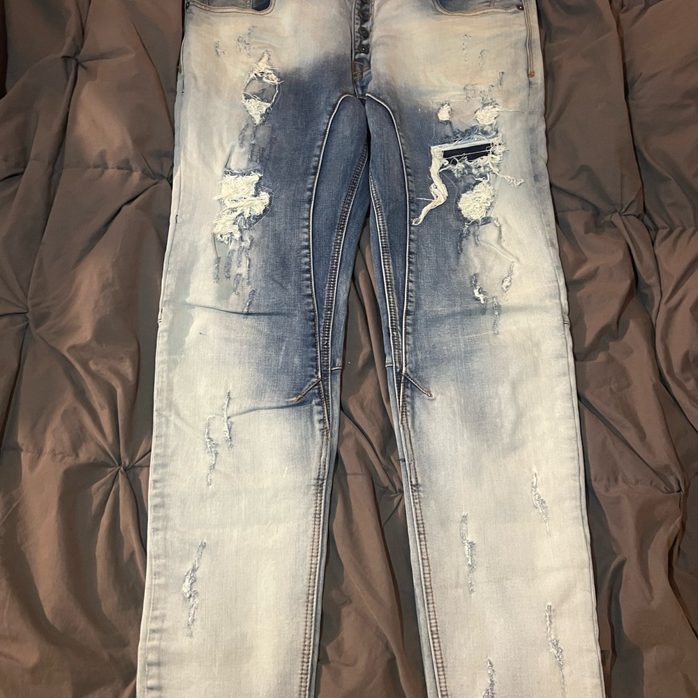Distressed Blue Denim Jeans